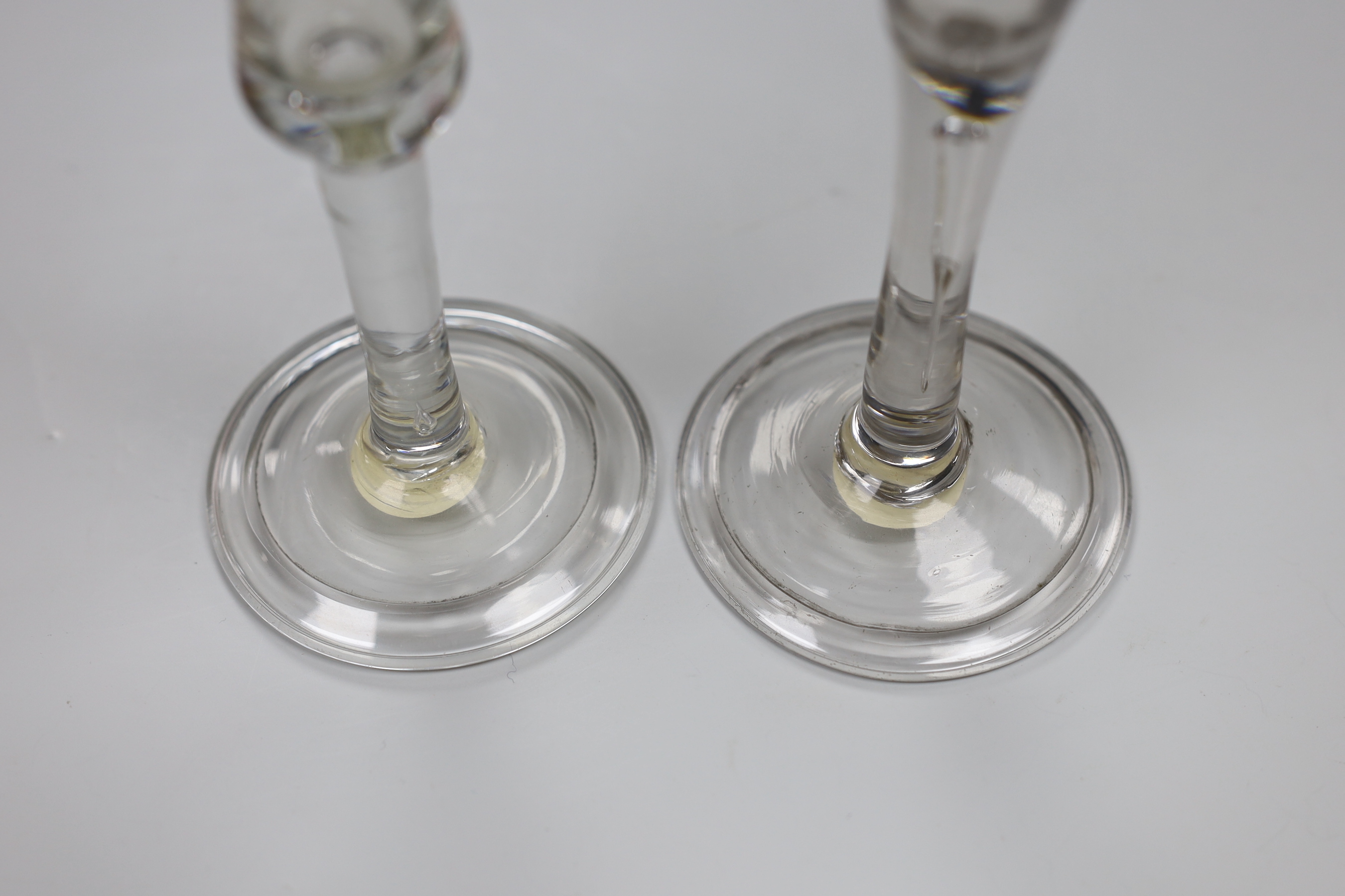 Two George II wine glasses, air tears and folded feet, tallest 16cm